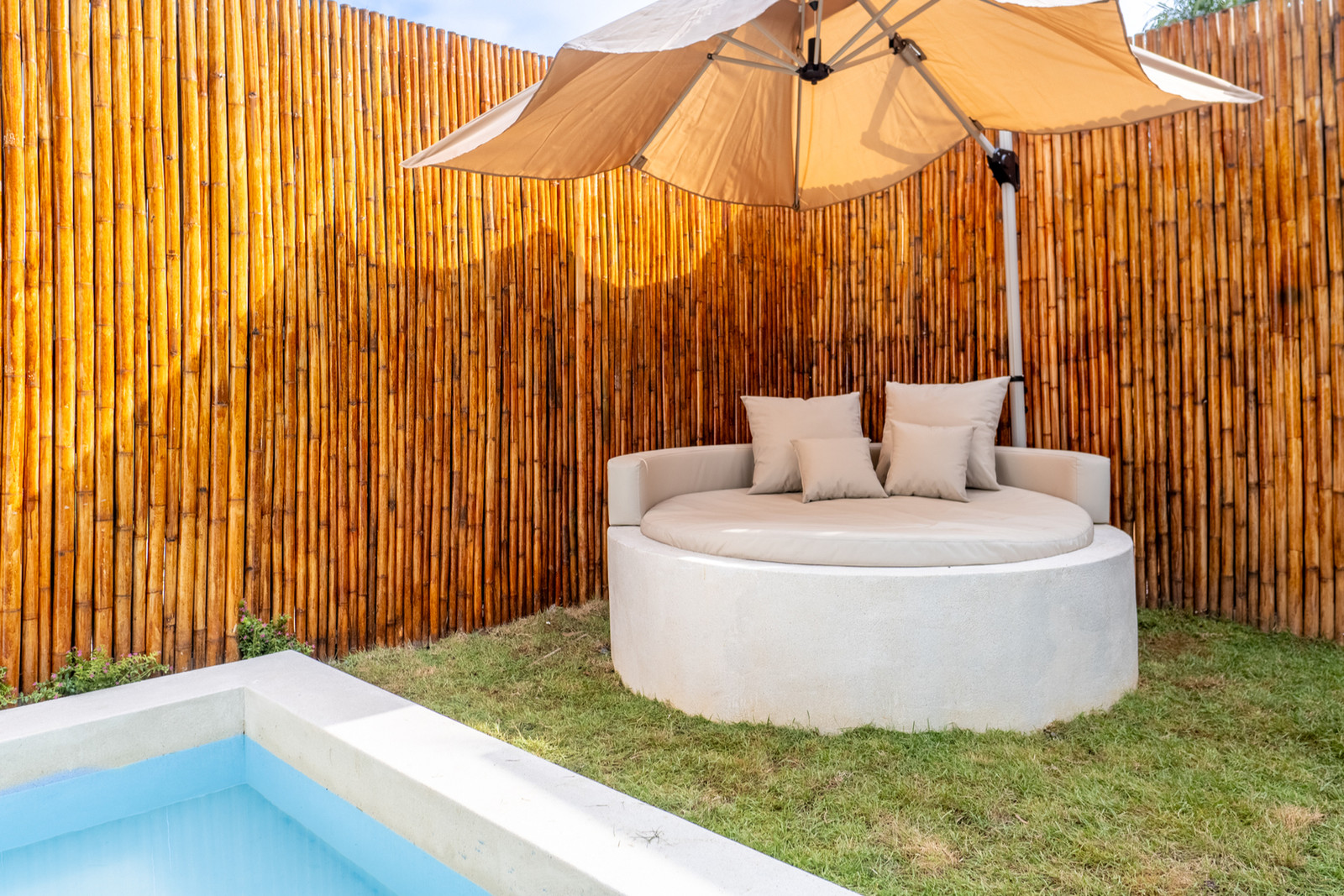 Round daybed by the pool at Beausoleil Koh Samui