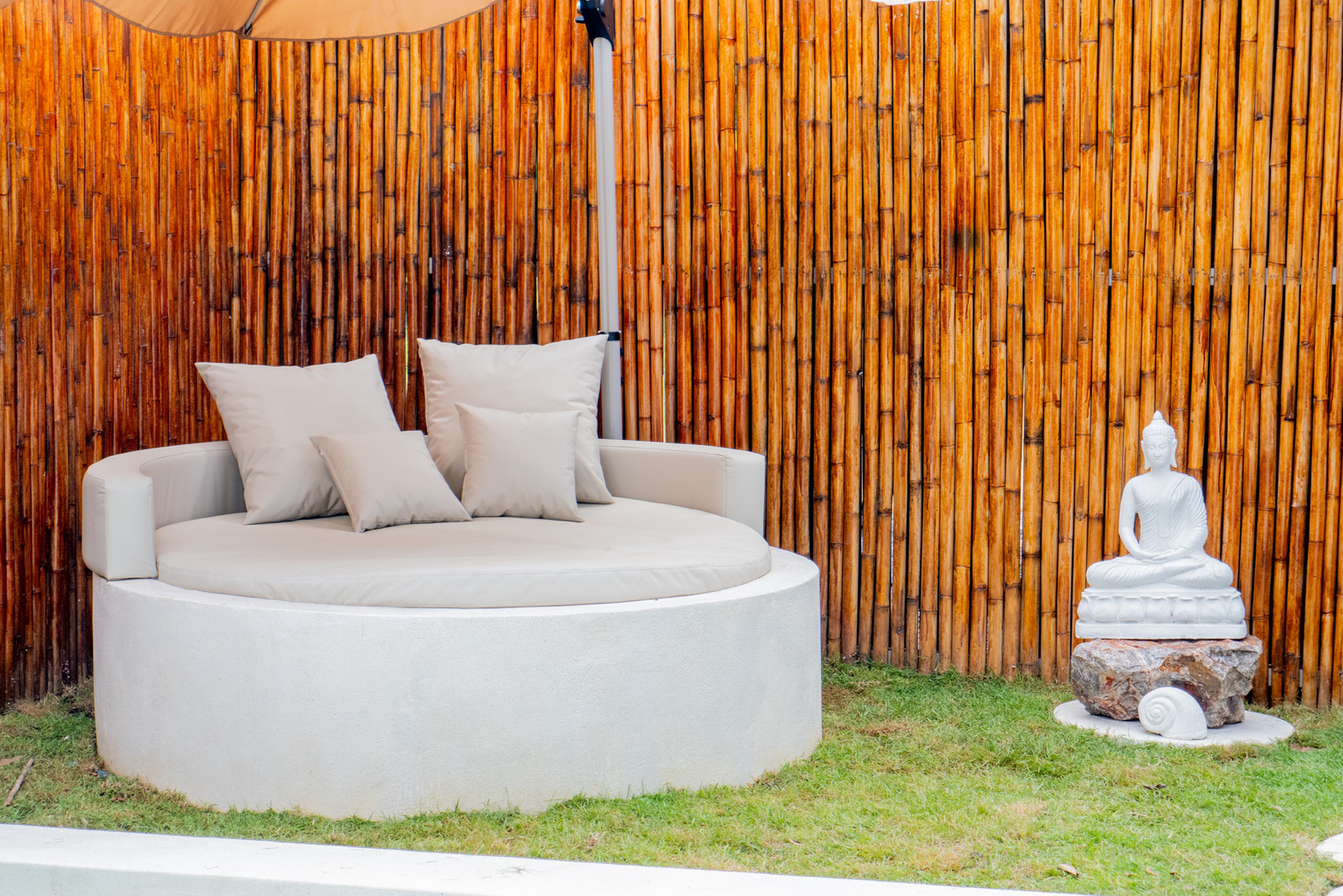 Garden daybed with a Buddha statue at Beausoleil Koh Samui